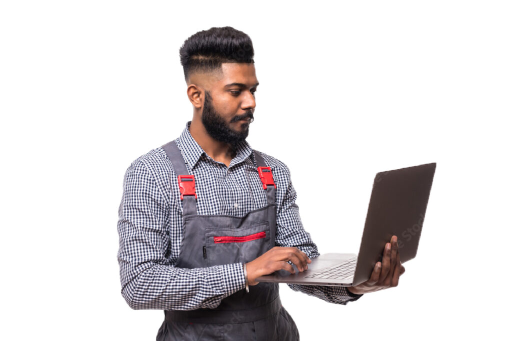 A worker holds a laptop computer as he takes an e-learning course on the job.